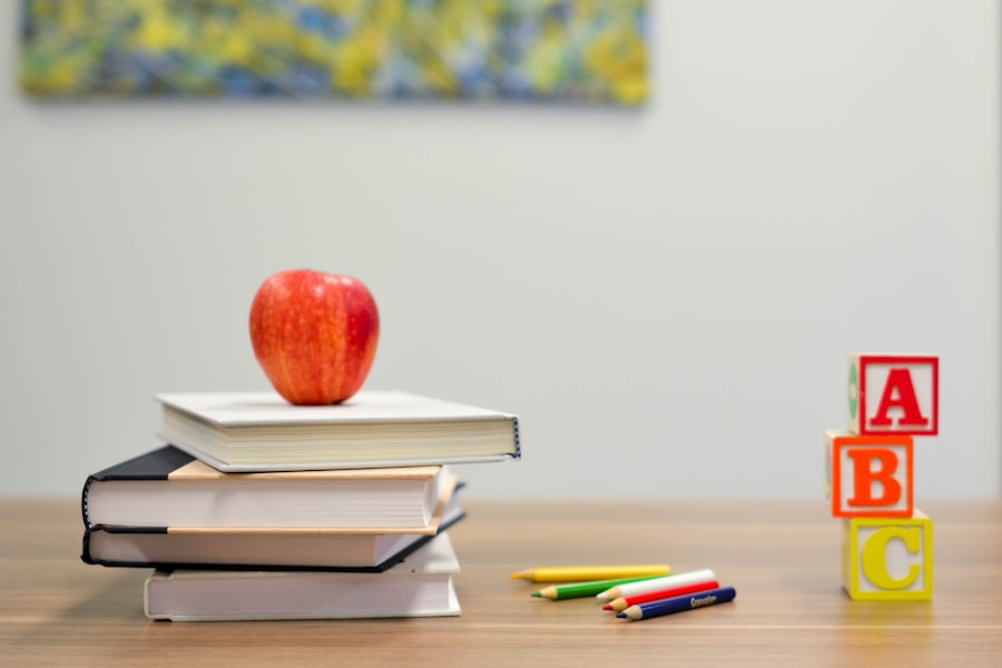 Stacked books, an apple and ABC blocks representing education